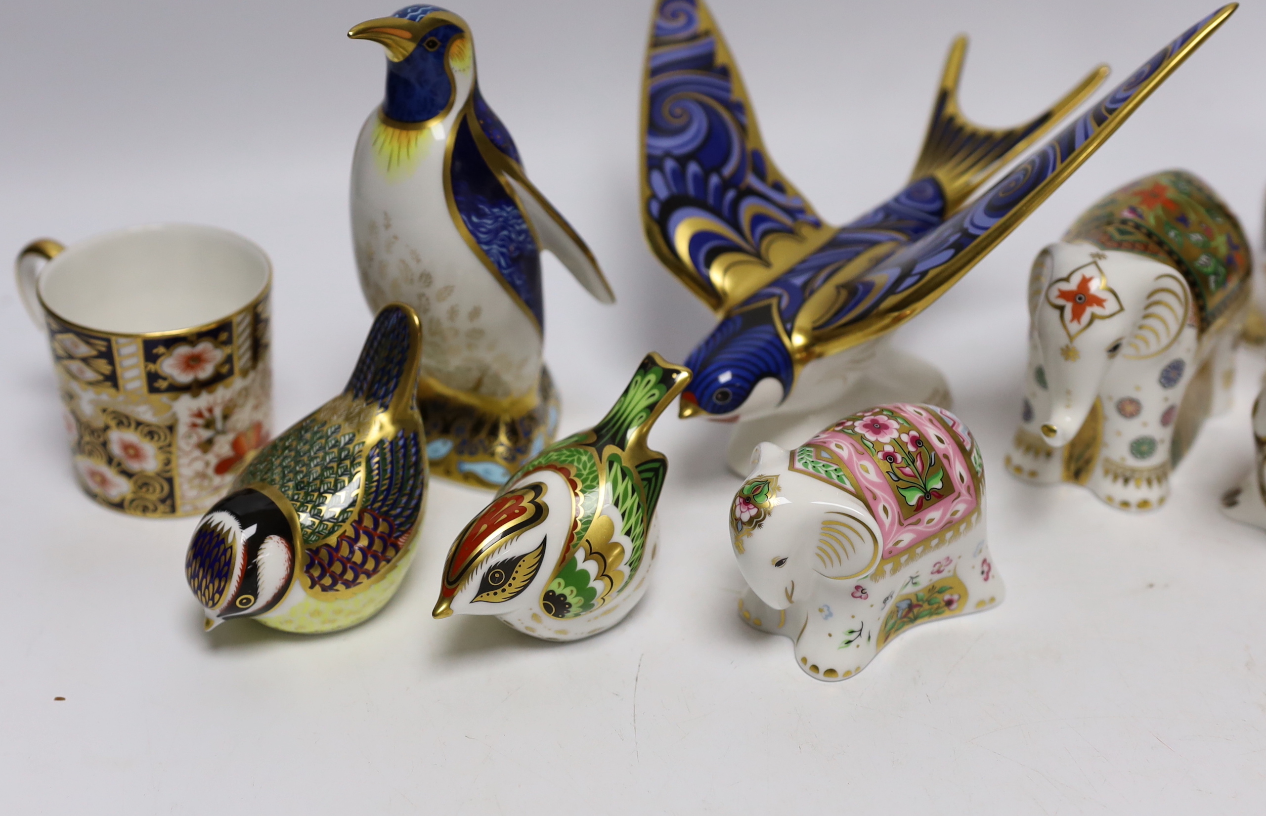 Eight Royal Crown Derby paperweight animal and bird models with boxes including Imari Hare and Emperor Penguin, largest 16cm wide